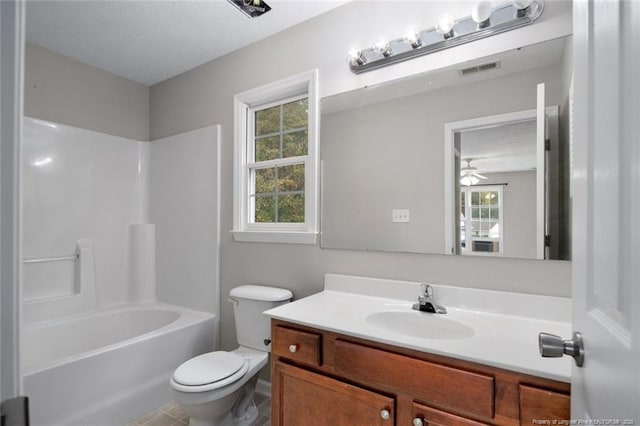 full bathroom with vanity, plenty of natural light,  shower combination, and toilet