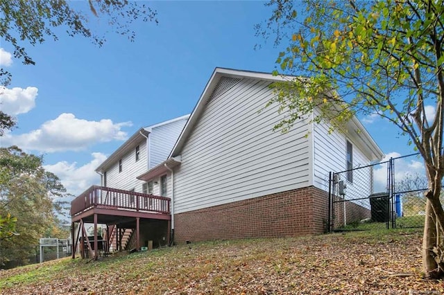 view of side of home with a deck