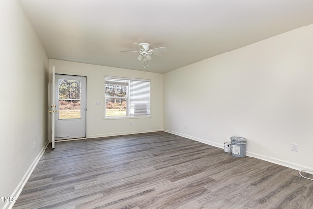 spare room with light hardwood / wood-style floors and ceiling fan