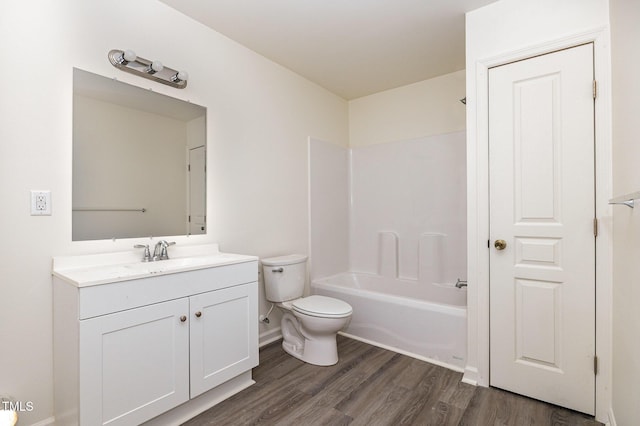 full bathroom featuring shower / bath combination, wood-type flooring, vanity, and toilet