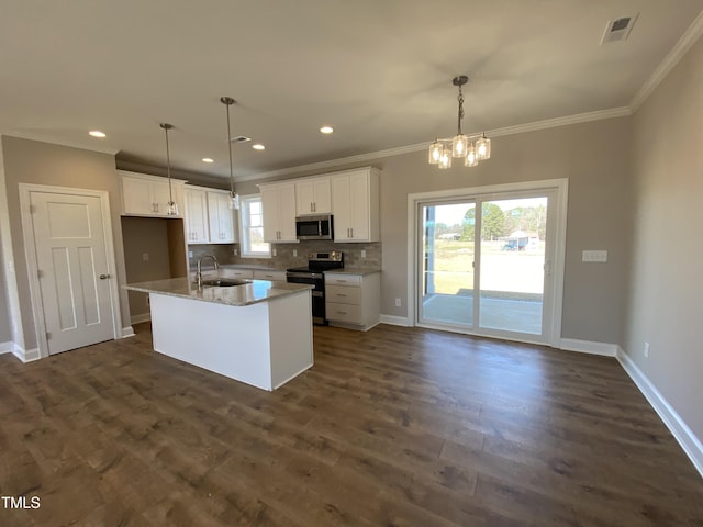 kitchen featuring decorative backsplash, visible vents, appliances with stainless steel finishes, dark wood-type flooring, and a sink
