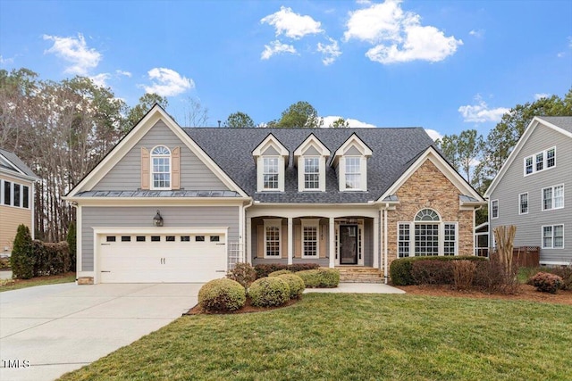 view of front of house with a front lawn and a garage