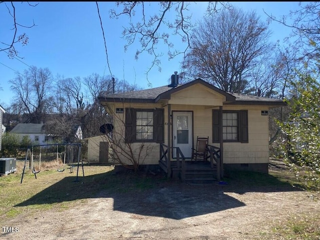 bungalow-style house with central AC, crawl space, and a playground