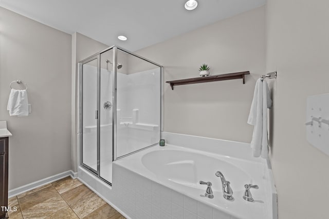 bathroom with vanity and plus walk in shower