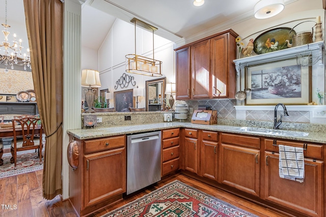 kitchen featuring a sink, decorative light fixtures, brown cabinets, dark wood finished floors, and dishwasher