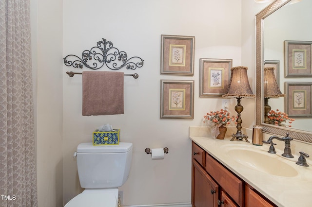 full bathroom with vanity and toilet