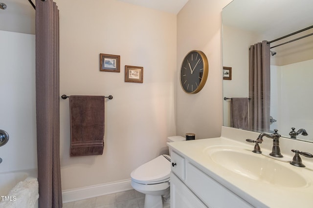 bathroom featuring baseboards, vanity, shower / bath combination with curtain, and toilet