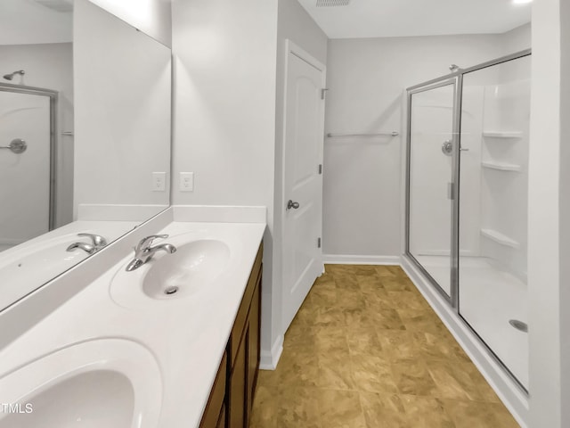 bathroom with vanity and an enclosed shower