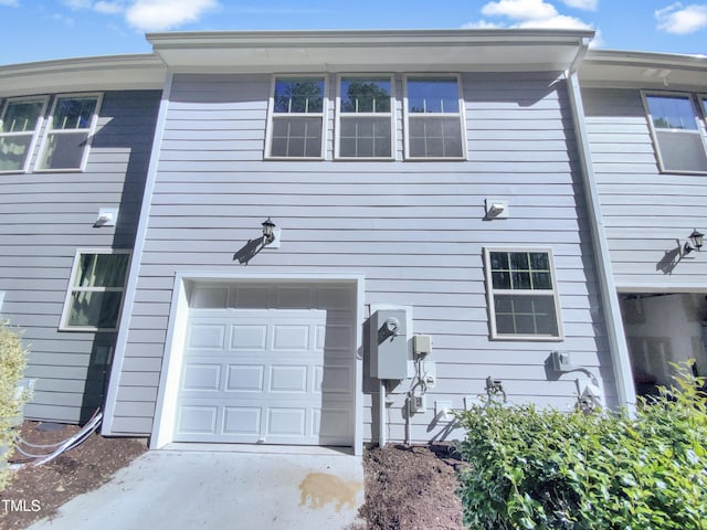 view of side of property featuring a garage