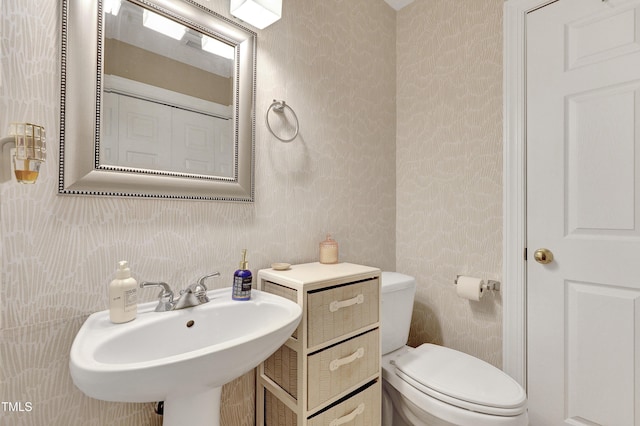 bathroom with sink and toilet