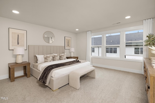 bedroom featuring light colored carpet