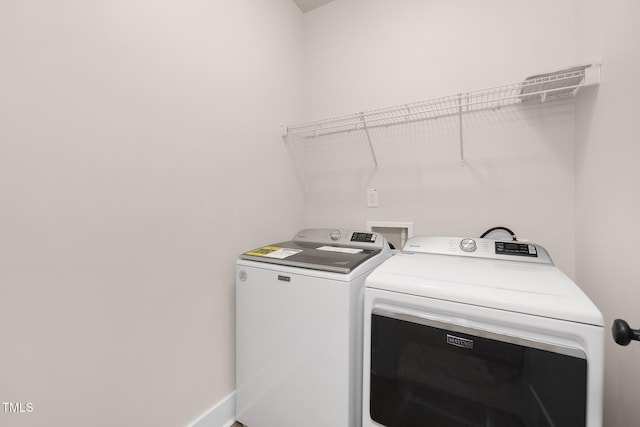 laundry room featuring separate washer and dryer