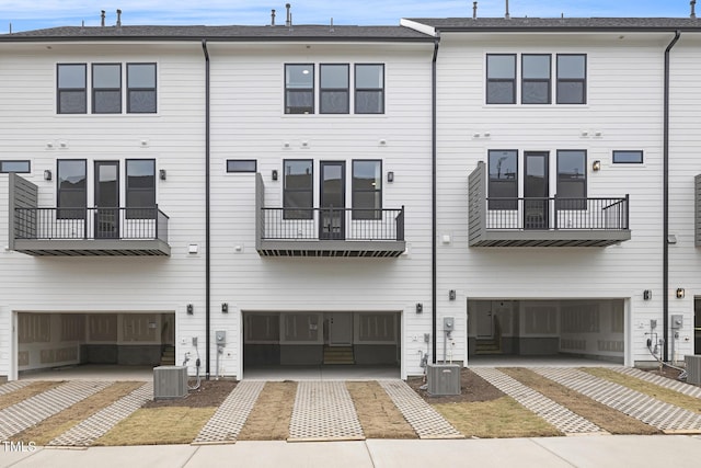 rear view of property with central air condition unit