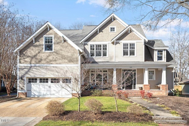 craftsman-style house featuring a garage and a porch