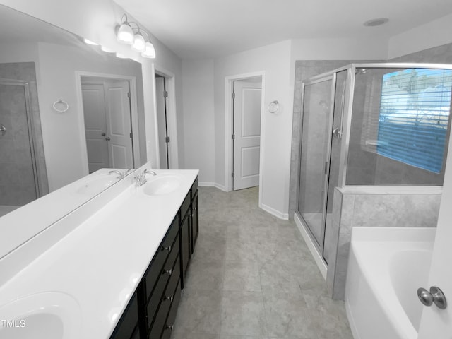 bathroom with vanity and separate shower and tub