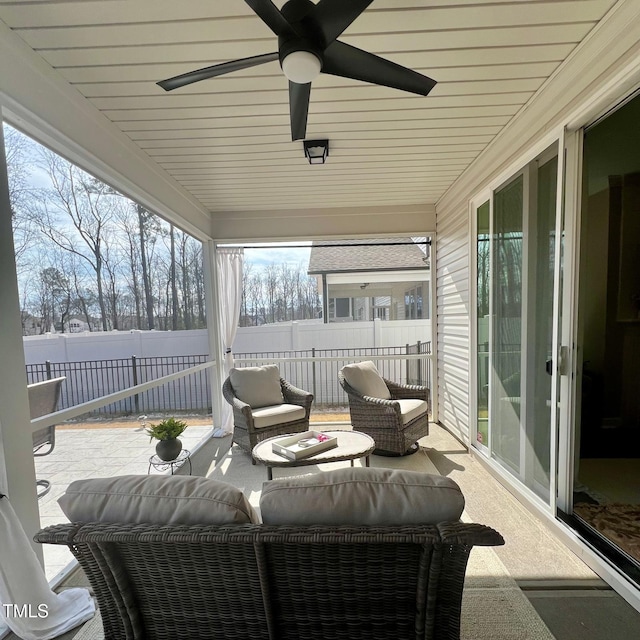 sunroom / solarium with ceiling fan