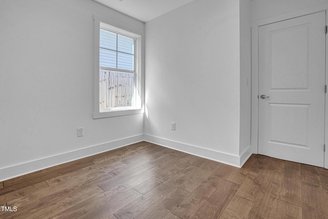 empty room with wood-type flooring