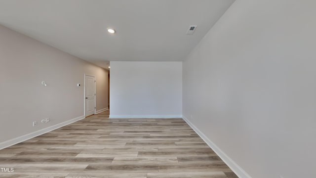 spare room featuring light wood-type flooring