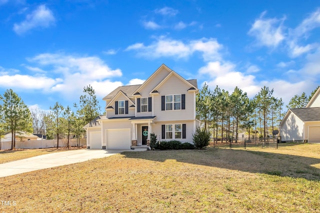 view of front of property with a garage and a front yard