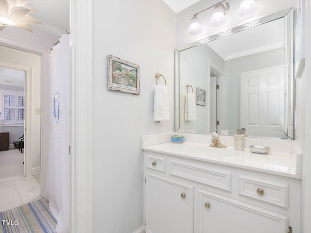 bathroom featuring crown molding and vanity