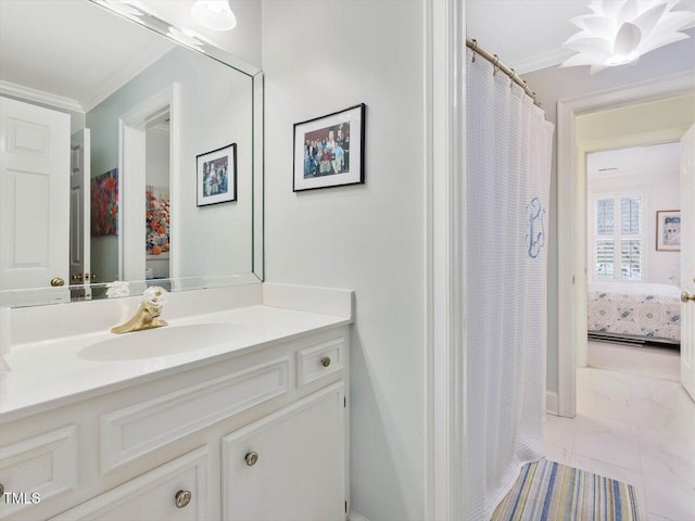 bathroom with crown molding and vanity