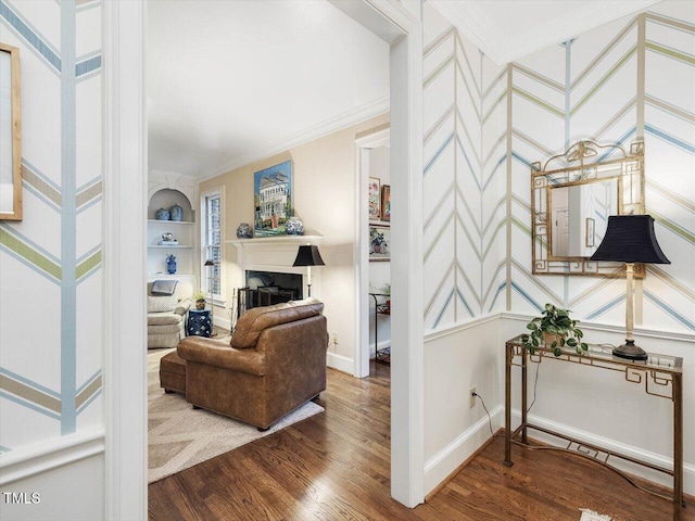 interior space with crown molding, wood-type flooring, and built in shelves