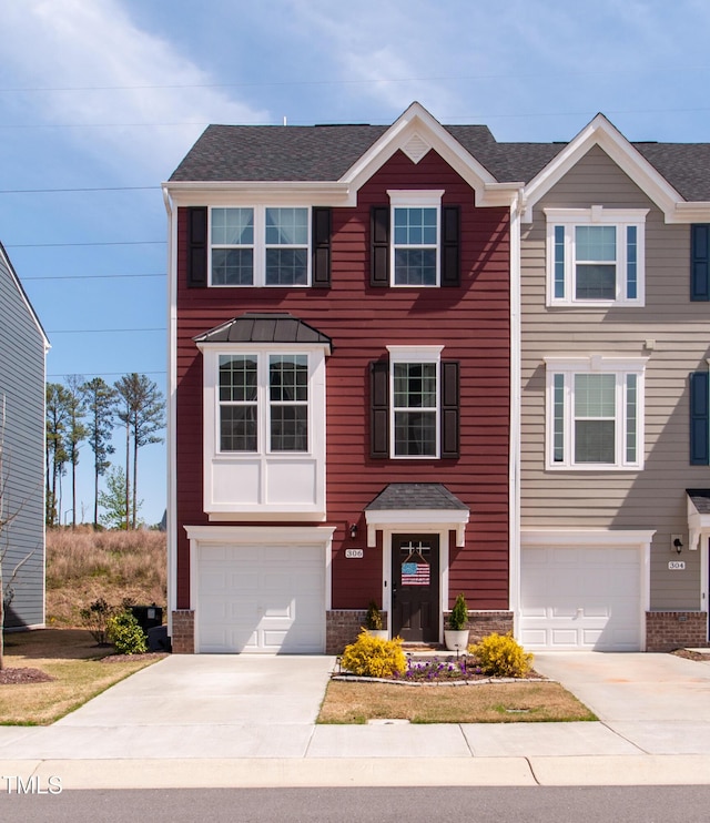 view of front of house featuring a garage and concrete driveway