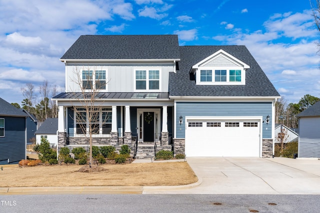 craftsman inspired home with covered porch, stone siding, driveway, and roof with shingles