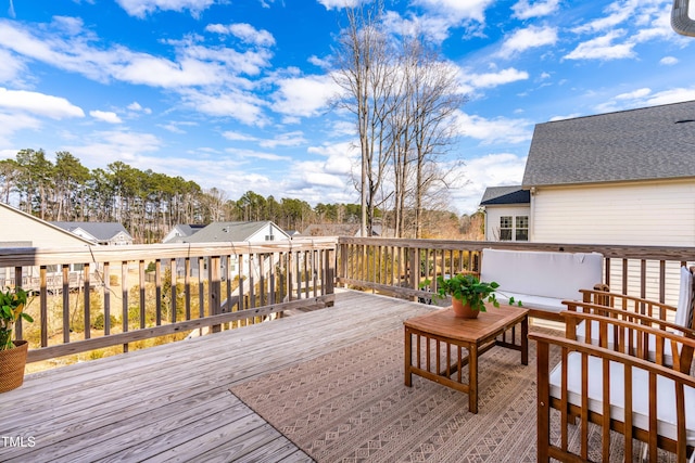 wooden deck with an outdoor hangout area