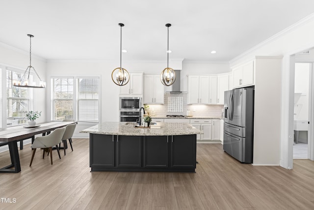 kitchen with stainless steel appliances, tasteful backsplash, white cabinets, and an inviting chandelier