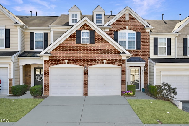 townhome / multi-family property featuring a garage