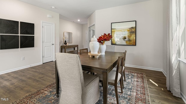 dining room with dark wood-type flooring