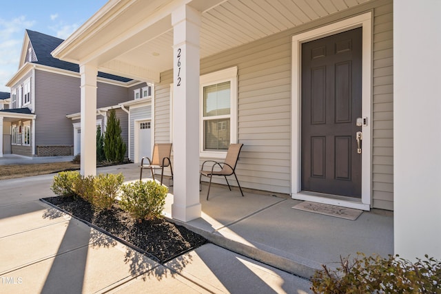 property entrance featuring covered porch