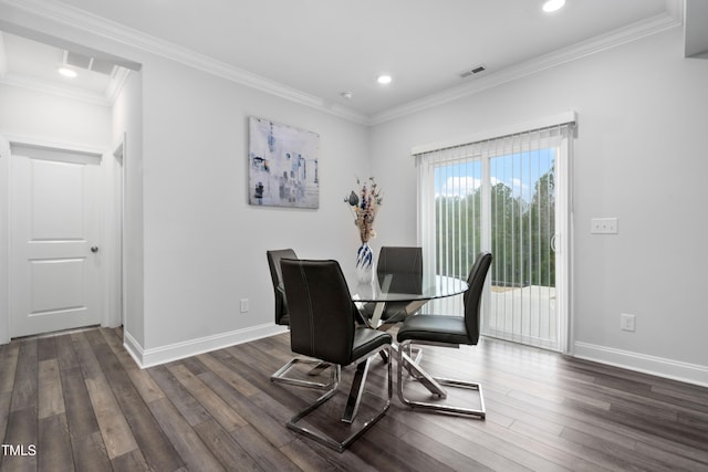 dining space featuring crown molding and dark hardwood / wood-style flooring