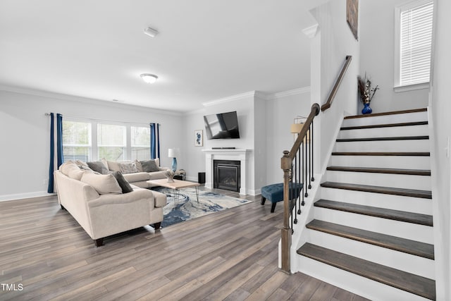 living room with ornamental molding and hardwood / wood-style flooring