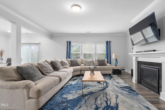 living room with dark hardwood / wood-style flooring and ornamental molding
