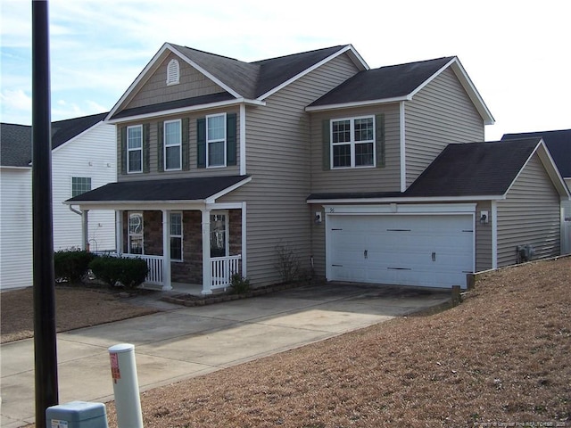 view of front of home with a porch and a garage