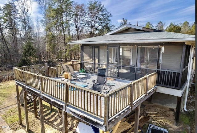 deck with a sunroom