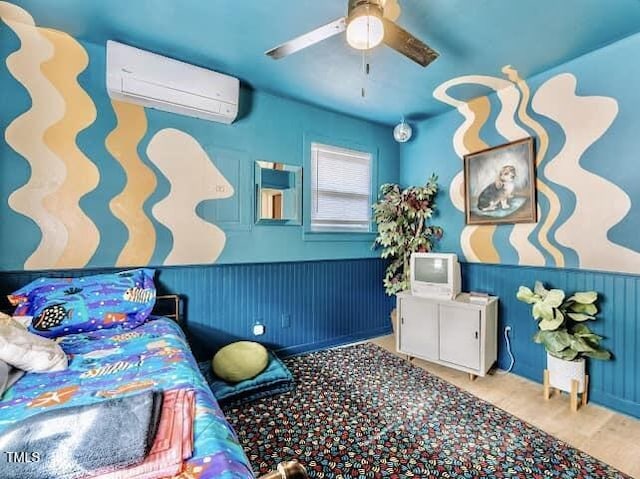 bedroom featuring a wall mounted air conditioner