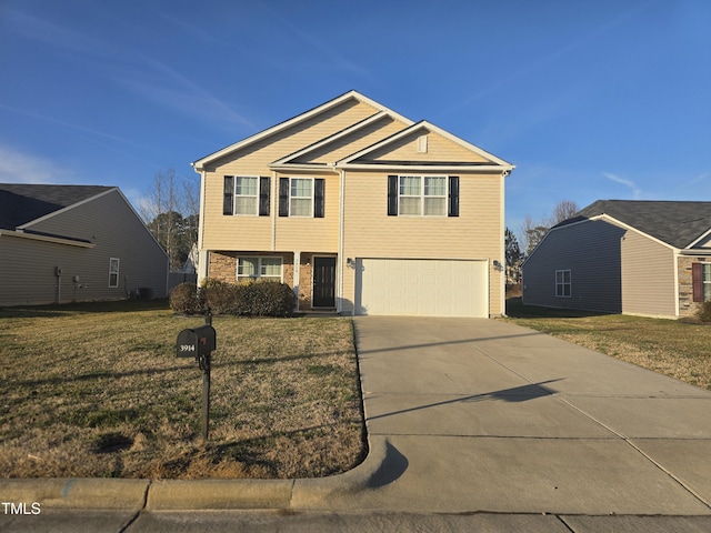 view of front facade with a garage and a front lawn