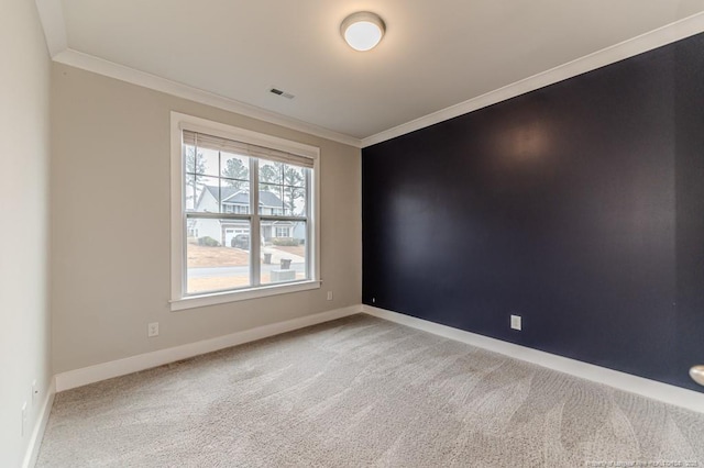 carpeted empty room featuring ornamental molding