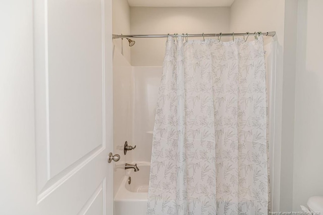 bathroom featuring shower / bath combination with curtain