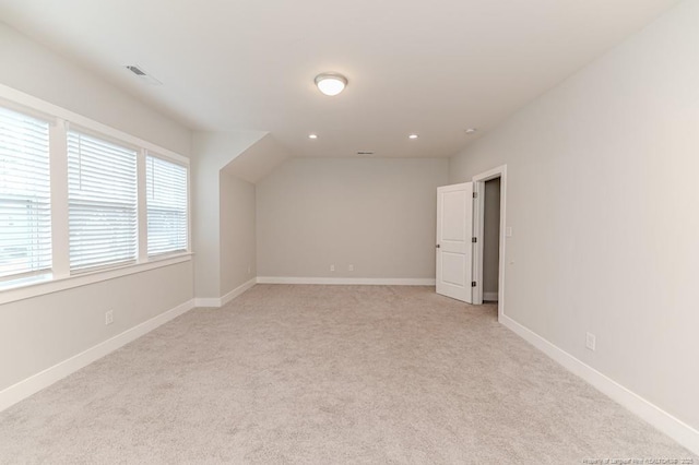 additional living space with light colored carpet