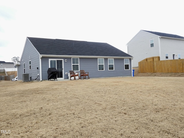 back of property featuring a yard, central AC, and a patio