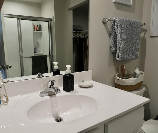 bathroom with vanity and walk in shower