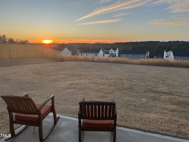 view of yard at dusk