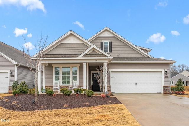 craftsman house featuring a garage and covered porch