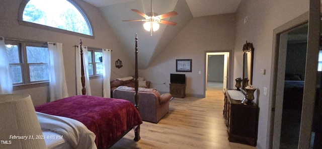 bedroom with lofted ceiling, light wood finished floors, and a ceiling fan