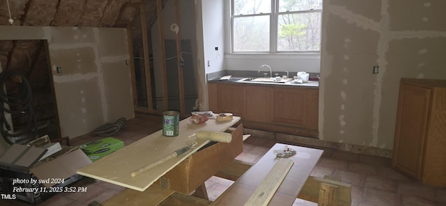 kitchen with brown cabinets and a sink