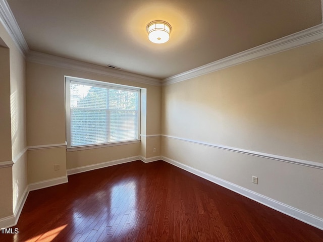 unfurnished room featuring crown molding and dark hardwood / wood-style flooring